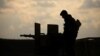 A member of Syrian Democratic Forces (SDF) stands on a pick up truck mounted with a weapon near Baghouz, Deir Al Zor province, Syria February 11, 2019.