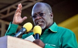 FILE - Tanzanian President John Magufuli gestures during an election rally in Dar es Salaam, Oct. 23, 2015.