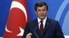 FILE - Then-Turkish Prime Minister Ahmet Davutoglu speaks to the media at the headquarters of the Justice and Development Party, AKP, in Ankara, Turkey, May 5, 2016.
