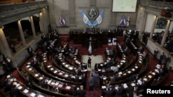 FILE - Congress members are seen taking a vote, in Guatemala City, Guatemala, Sept. 11, 2017. The U.S. announced new visa restrictions on Dec. 11, 2023, for hundreds of Guatemalan lawmakers, other leaders and their families.