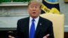 President Donald Trump speaks in the Oval Office of the White House, Feb. 13, 2019.