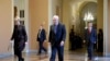 Senate Majority Leader Mitch McConnell of Ky. walks to the Senate chamber on Capitol Hill in Washington, Tuesday, March 24, 2020.