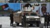 FILE - Afghan special forces stand guard near the site of a suicide bomb attack on the outskirts of Kabul, Afghanistan, April 29, 2020. 