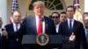 U.S. President Donald Trump acknowledges U.S. Trade Representative Robert Lighthizer and White House senior adviser Jared Kushner as he delivers remarks on the United States-Mexico-Canada Agreement (USMCA) during a news conference in the Rose Garden of th