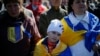 People attend a service in memory of protesters killed by police in during anti-government rallies, in Kyiv&#39;s Independence Square March 30, 2014.