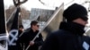 FILE - Members of Neo-Nazi groups are seen at a rally in Budapest, Hungary, Feb. 8, 2020.