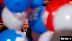 French politician Alain Juppe, current mayor of Bordeaux, a member of the conservative Les Republicains political party and candidate for their presidential primary, leaves a rally as he campaigns in Malakoff, Paris suburb, Oct. 8, 2016. 