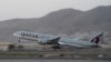 A Qatar Airways aircraft takes off with foreigners from the airport in Kabul, Afghanistan, Sept. 9, 2021, in the first such large-scale departure since U.S. and foreign forces concluded their frantic withdrawal from the country late last month.