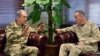 The U.S. chairman of the Joint Chiefs of Staff, Gen. Joseph Dunford, right, and Turkey's Chief of Staff Gen. Hulusi Akar talk during a meeting in Incirlik Airbase in Adana, Turkey, Feb. 17, 2017.