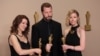 Mstyslav Chernov, Michelle Mizner and Raney Aronson - Rath pose with the Oscar for Best Documentary Feature Film for "20 Days in Mariupol" in the Oscars photo room at the 96th Academy awards in Hollywood, March 10, 2024.