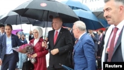 Turkish President Tayyip Erdogan and his wife Emine arrive at Kansai International Airport ahead of the start of G-20 leaders summit, in Izumisano, Osaka prefecture, Japan, June 27, 2019.