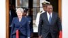 Britain's Prime Minister Theresa May and Kenya's President Uhuru Kenyatta arrive to address a joint news conference at the State House in Nairobi, Kenya, Aug. 30, 2018.