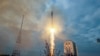 In this handout picture taken and released by the Russian Space Agency Roscosmos on August 11, 2023, a Soyuz 2.1b rocket with the Luna-25 lander blasts off from the launch pad at the Vostochny cosmodrome, some 180 km north of Blagoveschensk, in the Amur r