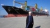 FILE - Iranian President Hassan Rouhani poses at a newly built extension of the port of Chabahar, near the Pakistan border.