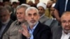 FILE - Yahya Sinwar greets supporters on the sea side of Gaza City, April 30, 2022. On Sept. 3, 2024, the U.S. Justice Department announced criminal charges against Sinwar and other senior militants in connection with the Oct. 7, 2023, rampage in Israel.