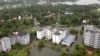 An aerial view shows partially submerged buildings at a flooded area in the southern state of Kerala, India, Aug. 19, 2018.