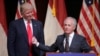 FILE - Then-Republican presidential candidate Donald Trump listens as Senator Bob Corker of Tennessee speaks at a campaign rally in Raleigh, N.C., July 5, 2016. Corker has drawn Trump's ire for questioning whether the president has the "stability" and "competence" needed to succeed in office.