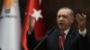 Turkey's president and leader of Turkey's Justice and Development (AK) Party, Recep Tayyip Erdogan, delivers a speech during his party's parliamentary group meeting at the Grand National Assembly of Turkey, in Ankara, Feb. 5, 2019.