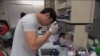 In a lab at Johns Hopkins University, students stitch together machine-made strands of DNA, the chemical that carries the genetic blueprints of life. 