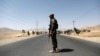 An Afghan National Army (ANA) soldier keeps watch at a checkpoint on the Ghazni highway, in Maidan Shar, the capital of Wardak province, Afghanistan, Aug. 12, 2018.