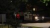 Law enforcement members guard the perimeter of the home of Republican presidential candidate and former U.S. President Donald Trump's shooting suspect