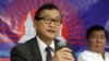 Exiled Cambodian opposition leader Sam Rainsy, left, talks about the opposition's plans for 2013 elections in Cambodia on Sept. 10, 2012, in San Juan, Philippines. 