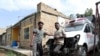 FILE - Eritrean nationals Goitom Tesfaye, 24, left, and Filimon Daniel, 23, are pictured at their garage in Mekele, Tigray region, Ethiopia, July 7, 2019.