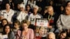 Relatives, friends and supporters of Elkana Bohbot, who has been held hostage in Gaza since the October 7 attack by Hamas militants in southern Israel, take part in a protest to ask for the release of Israeli hostages, in Tel Aviv on Nov. 22, 2023.