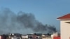 A plume of smoke rises in Bamako as shots and detonations are heard, in this image taken from an AFPTV video on Sept. 17, 2024. Unidentified gunmen attacked at least one police base in the Malian capital of Bamako on the morning of September 17, a police source said.