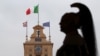 A member of the Italian elite military unit Cuirassiers' Regiment, who are honor guards for the Italian president, stands guard prior to Carlo Cottarelli's meeting with Italy's President Sergio Mattarella at the Quirinal Palace in Rome, Italy, May 29, 2018.