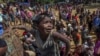 A Rohingya Muslim boy, who crossed over from Myanmar into Bangladesh, pleads with aid workers to give him a bag of rice near Balukhali refugee camp, Bangladesh, Thursday, Sept. 21, 2017. 