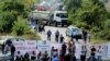 Kosovo war veterans block the road ahead of Serbian President Aleksandar Vucic's planned visit near the village of Banje, Kosovo, Sept. 9, 2018. 