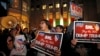 FILE - Demonstrators protest Republican presidential candidate Donald Trump's guest host appearance on "Saturday Night Live" at NBC Studios in New York, Nov. 4, 2015. 