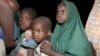 FILE - Children rescued from Boko Haram kidnappers by Nigeria soldiers in the Sambisa forest arrive at a camp in Yola, Nigeria, May 2, 2015. 