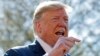 President Donald Trump speaks to members of the media on the South Lawn of the White House in Washington, before boarding Marine One helicopter, April 10, 2019. 