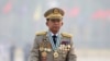 FILE - Myanmar's Commander-in-Chief Senior General Min Aung Hlaing presides an army parade on Armed Forces Day in Naypyitaw, Myanmar, March 27, 2021.