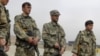 Afghan police keep watch at a checkpoint in Kabul, April 10, 2012.