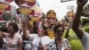 Protesters march towards the Chinese consulate during a rally in Manila's financial district of Makati, Philippines, May 11, 2012.