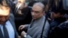 Pakistan's former president Asif Ali Zardari, center, arrives at a court in Karachi, Pakistan, Dec. 21, 2018. 