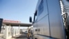 FILE - Syria-bound trucks, loaded with humanitarian supplies, arrive at Turkish Cilvegozu border gate, located opposite Syrian commercial crossing point Bab al-Hawa in Reyhanli, in the southern Hatay province, Turkey, Nov. 28, 2016.