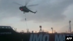 This image grab taken from a video provided by Iran's Revolutionary Guard official website via SEPAH News, July 20, 2019, allegedly shows Revolutionary Guard Corps boarding the British-flagged tanker Stena Impero in the Strait of Hormuz.