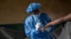 Atumisi Anaclet treats a patient with mpox on Sept. 4, 2024, in a hospital in Kamituga, in eastern Congo's South Kivu province, which is the epicenter of the world's latest outbreak of the disease. 