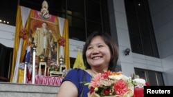 Chiranuch Premchaiporn, Thai website editor, leaves the Bangkok Criminal Court in Bangkok, May 30, 2012.
