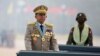 FILE - Myanmar's junta chief Senior General Min Aung Hlaing presides over an army parade on Armed Forces Day in Naypyitaw, March 27, 2021. 