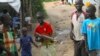FILE - A group of children at the U.N. protection of civilians site in Juba, South Sudan, play with a toy gun. 