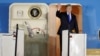U.S. President Donald Trump waves upon his arrival at Paya Lebar Air Base in Singapore, before his summit with North Korean leader Kim Jong Un, June 10, 2018. 