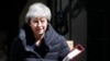 FILE - Britain's Prime Minister Theresa May leaves 10 Downing Street for the House of Commons for her weekly Prime Minister's questions in London, May 1, 2019.