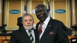 Former president of Ghana, John Agyekum Kufuor, right, and former president of Brazil, Luiz Inacio Lula Da Silva, receive the 2011 World Food Prize in Des Moines, Iowa on Thursday, Oct. 13, 2011.