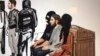 In this courtroom sketch, Salah Abdeslam, right, and Soufiane Ayari, left, appear at the Brussels Justice Palace in Brussels on Monday, Feb. 5, 2018. 
