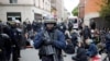 Riot police detain protesters after clashes broke out with activists on the sidelines of the traditional May Day rally in the center of Paris, France, May 1, 2018. 